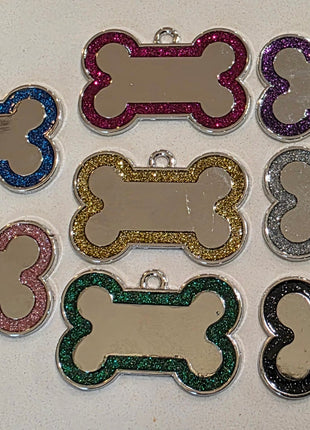 Bone-shaped dog tag featuring a glitter border